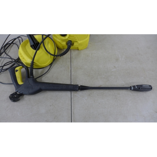 5206 - A Karcher K2 pressure washer with hose, lance and patio cleaner attachment