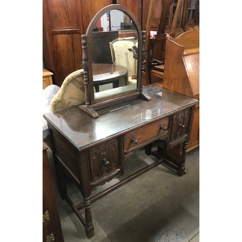 261 - An early 20th Century Gothic style oak dressing table