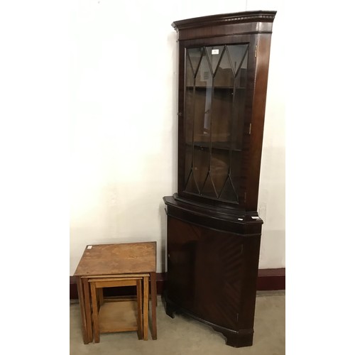 263 - A George III style mahogany freestanding corner cabinet and an oak nest of tables