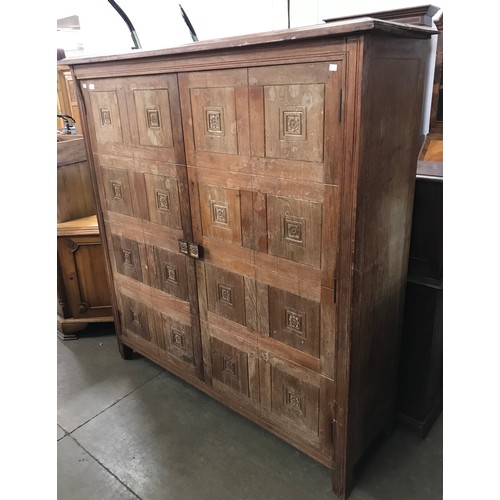 264 - An eastern fitted hardwood two door marriage cupboard