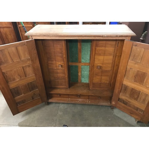 264 - An eastern fitted hardwood two door marriage cupboard