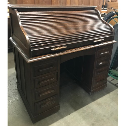 266 - An early 20th Century oak tambour roll top desk