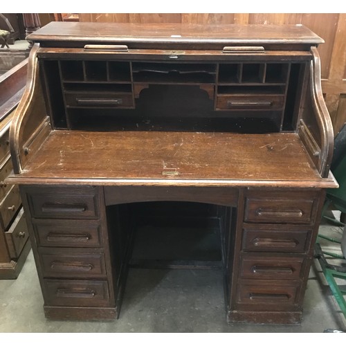 266 - An early 20th Century oak tambour roll top desk