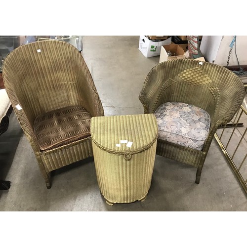 272 - Two Lloyd Loom wicker chairs and an ottoman