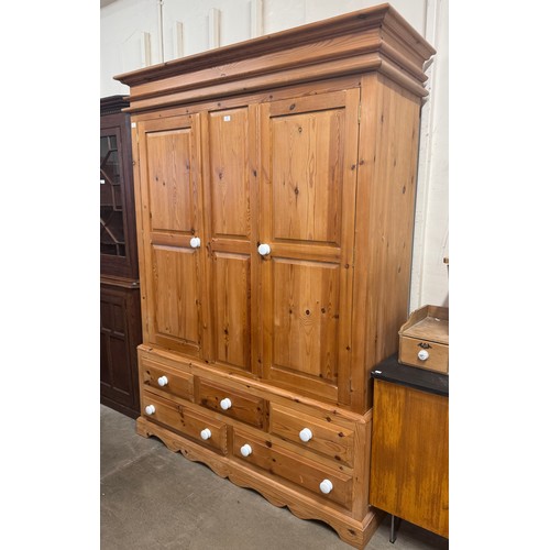 292 - A Victorian style pine three door wardrobe