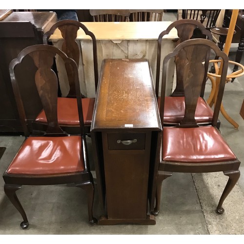 277 - An early 20th Century oak drop leaf table and four Queen Anne style mahogany dining chairs