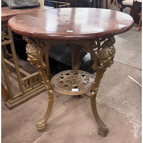 294 - A Victorian style mahogany and cast iron based pub table