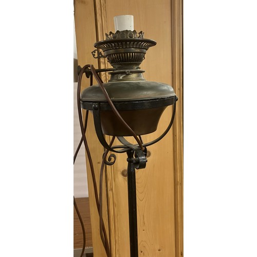 307 - A Victorian brass and wrought iron floor standing lamp