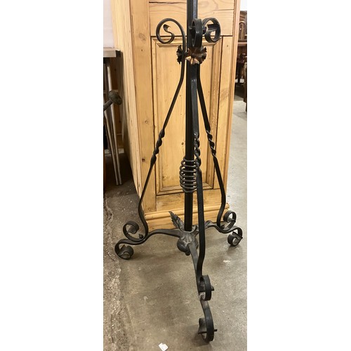 307 - A Victorian brass and wrought iron floor standing lamp