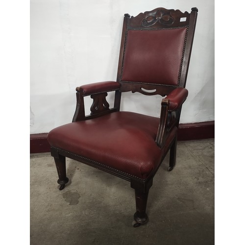 226 - An Art Nouveau beech and red vinyl armchair