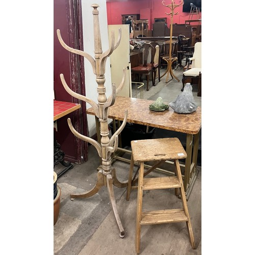 317 - An oak shop display hat stand and a set of ladders