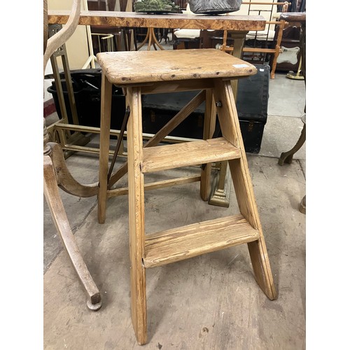 317 - An oak shop display hat stand and a set of ladders