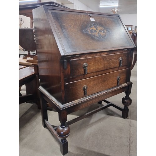 249 - An early 20th Century oak bureau