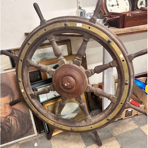 361 - An oak and brass mounted ship's wheel