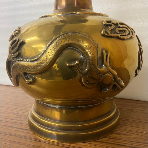 321 - A large Chinese gilt metal vase, decorated with dragons