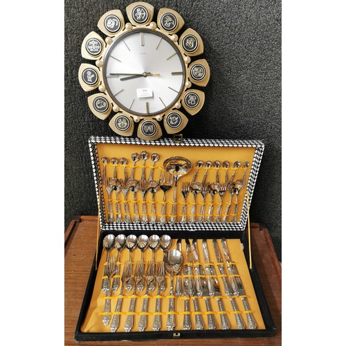 356 - A 1960s canteen of stainless steel cutlery and a Metamec Zodiac wall clock