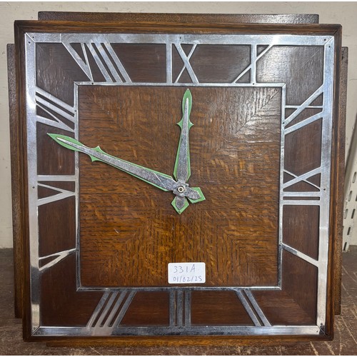 331A - An Art Deco oak wall clock