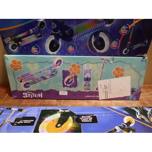 6112 - Three children's in-line folding scooters: Batman, Disney stitch, and electro life nova