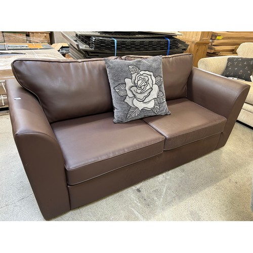 3292 - A brown leather three seater sofa (tear on the front and the back)