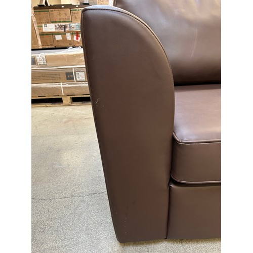 3292 - A brown leather three seater sofa (tear on the front and the back)