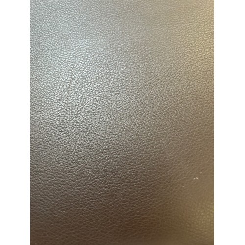 3292 - A brown leather three seater sofa (tear on the front and the back)