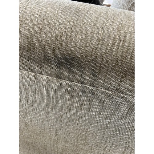 3295 - An oatmeal upholstered three seater sofa (marked cushions)