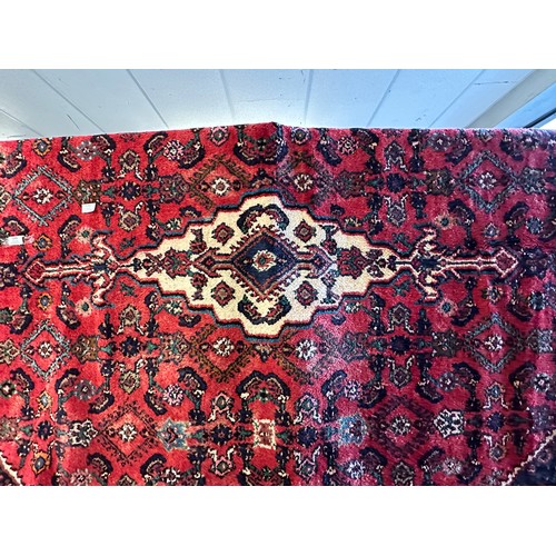 3260 - A hand woven Persian Surok full wool pile carpet with a traditional design