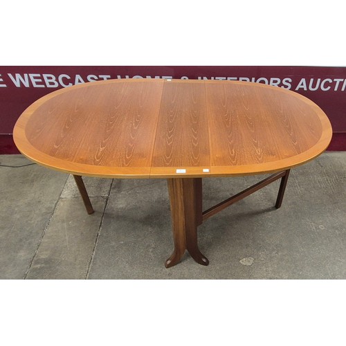 19 - A Nathan teak drop leaf table