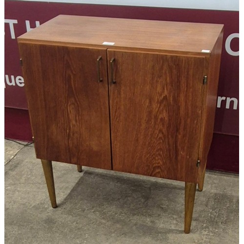 23 - A Danish teak two door record cabinet