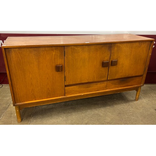 24 - A teak sideboard