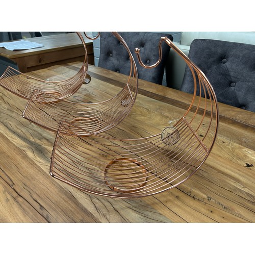 3053 - A set of three copper wire fruit hammocks