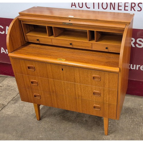 31 - A Swedish SMI teak cylinder top desk, designed by Egon Ostergaard