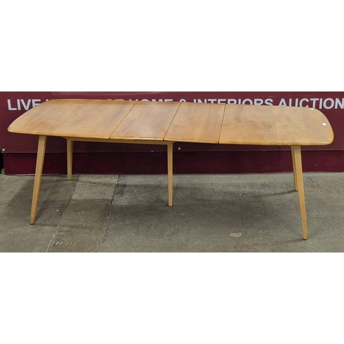 33 - An Ercol Blonde elm and beech Grand Windsor extending dining table