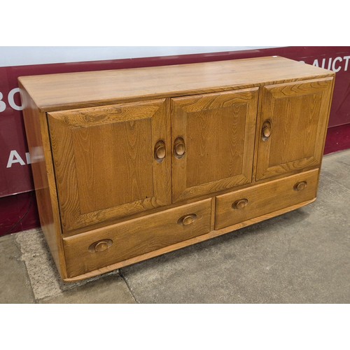 32 - An Ercol Blonde elm Windsor sideboard