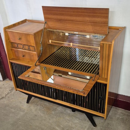 40 - A walnut cocktail sideboard