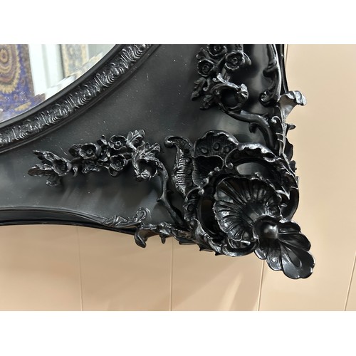 3020 - A black carved frame wall mirror