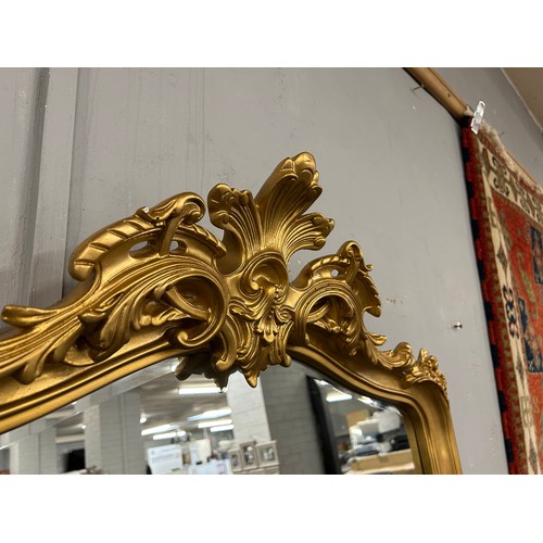 3029 - A large gold ornate free standing mirror