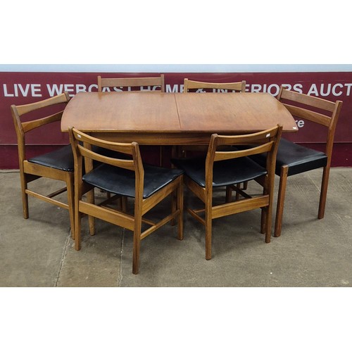 49 - A teak rectangular extending dining table and six chairs (4+2)