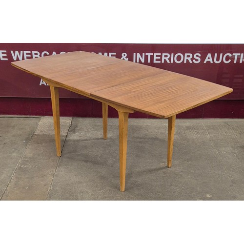 63 - A teak rectangular extending dining table