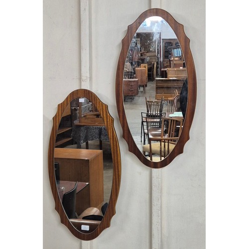 71 - A pair of oval teak framed mirrors