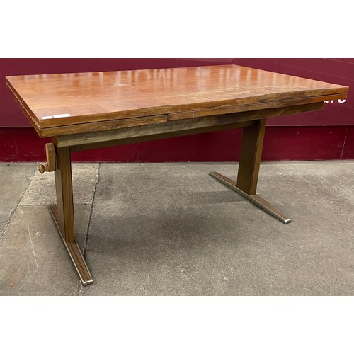 73 - A German rise and fall teak and chrome coffee table