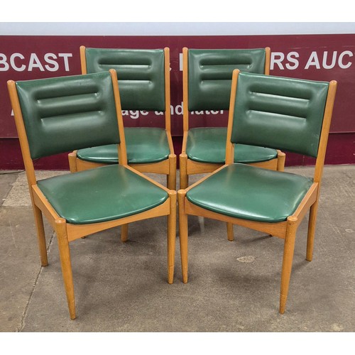 77 - A set of four Morris of Glasgow teak and green vinyl dining chairs