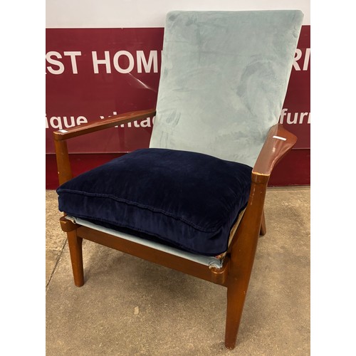 94 - A Parker Knoll teak and fabric upholstered armchair