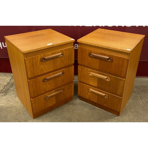 91 - A pair of teak three drawer bedside chests