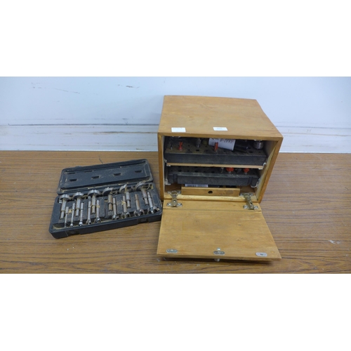 5025 - A set of router cutting bits in wooden case with a cased set of bore cutting bits