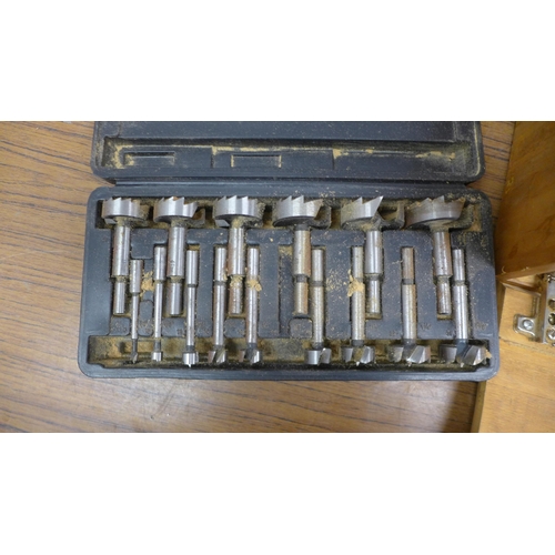 5025 - A set of router cutting bits in wooden case with a cased set of bore cutting bits