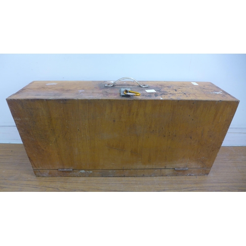 5055 - A wooden box of tools including saws, brace drill, sharpening stone, hammer, etc.