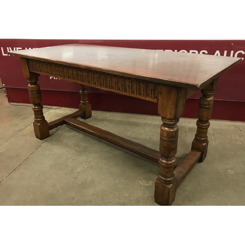 108 - An 17th Century style carved oak refectory table