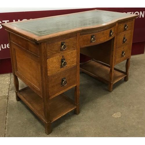 112 - An Arts and Crafts Shapland & Petter oak and green leather topped desk