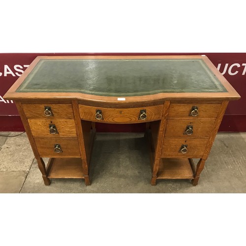 112 - An Arts and Crafts Shapland & Petter oak and green leather topped desk